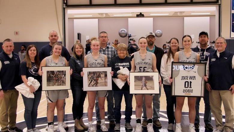 A group photo from the 2025 Penn State DuBois women’s basketball team senior day festivities. Members of the team that were honored are joined by family members and members of the coaching staff.